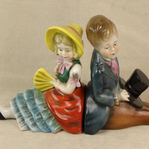 Set Junge und Mädchen Porzellan Figuren Buchstützen