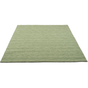 Wollteppich THEKO Holi Teppiche Gr. B/L: 140 cm x 200 cm, 13 mm, 1 St., grün (hellgrün) Esszimmerteppiche Uni-Farben, leicht meliert, reine Wolle, handgewebt mit Knüpfoptik