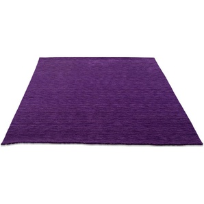 Wollteppich THEKO Holi Teppiche Gr. B/L: 70 cm x 140 cm, 13 mm, 1 St., lila (violett) Esszimmerteppiche Uni-Farben, leicht meliert, reine Wolle, handgewebt mit Knüpfoptik
